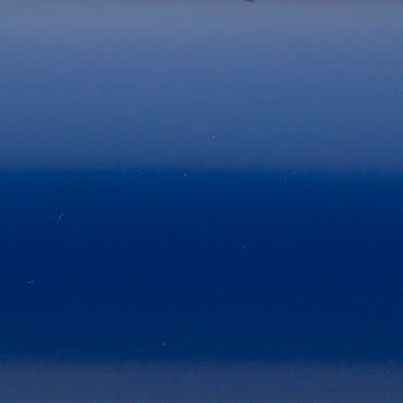 Smooth glossy blue panel centered, showing horizontal gradient bands; reflecting faint scratches and diffuse highlights; fills the frame, suggesting a close-up of painted metal or plastic under soft lighting.