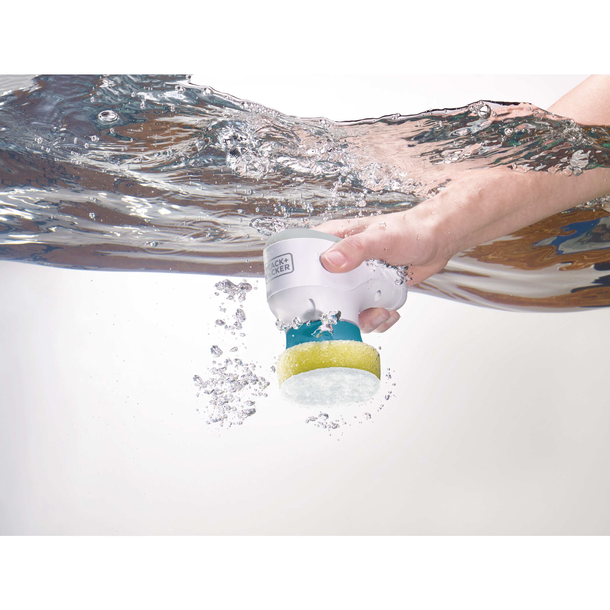 Grime buster Multi Purpose handheld sponge being submerged underwater by a person.