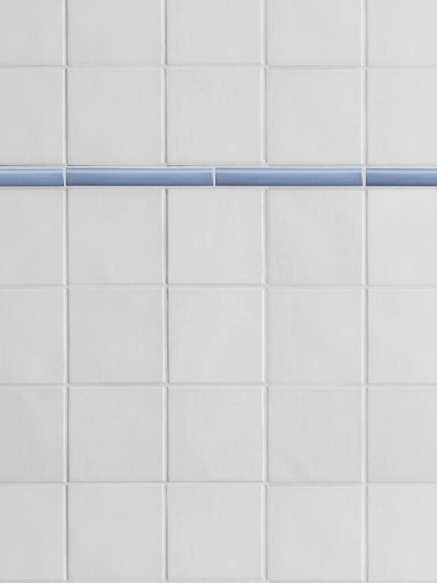 a close up of a white tiled wall with a blue stripe.