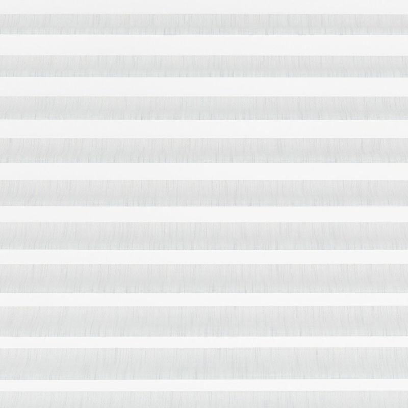 Zebra roller blind covering a window, horizontal alternating translucent and opaque fabric bands, aligned to filter soft daylight across a neutral, evenly lit interior.