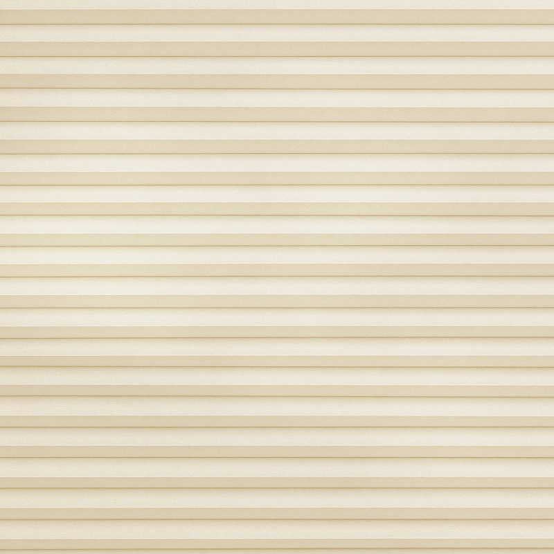 Beige pleated cellular blind, stretched across the frame; fully lowered and closed, softly diffusing light in a neutral, softly lit interior with no visible view.