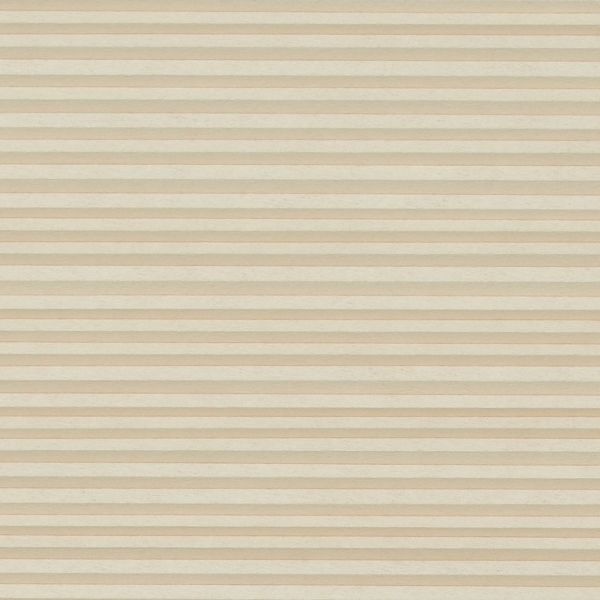 Beige cellular (honeycomb) blind with narrow horizontal pleats, fully lowered and closed, softly filtering light across an undecorated neutral interior with no visible window or outside view.