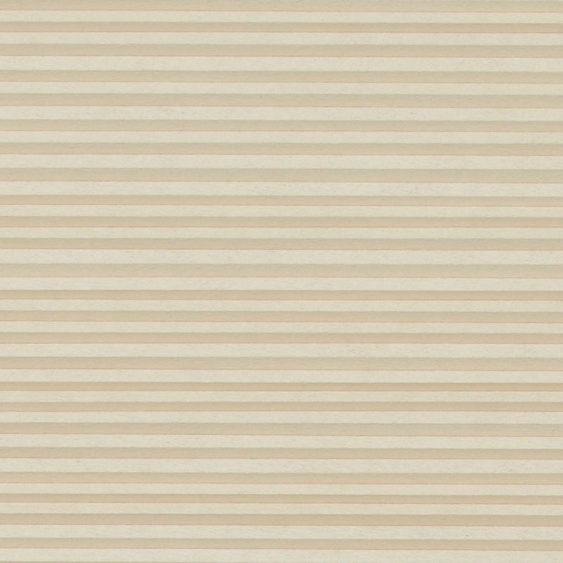 Beige cellular (honeycomb) blind with narrow horizontal pleats, fully lowered and closed, softly filtering light across an undecorated neutral interior with no visible window or outside view.