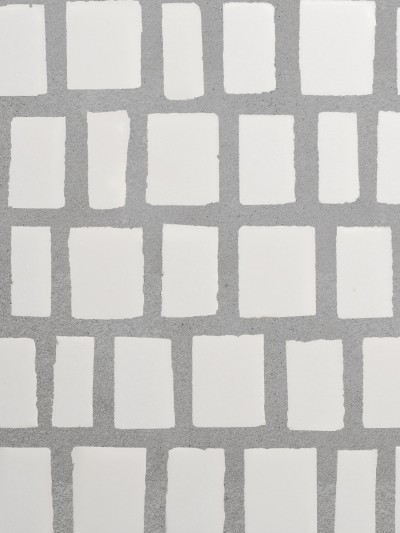 a white tile with white squares on it.