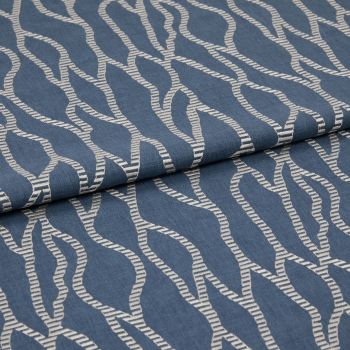 Blue woven fabric with cream embroidered wavy rope pattern, folded over itself, shown in a close-up studio view with soft, even lighting.