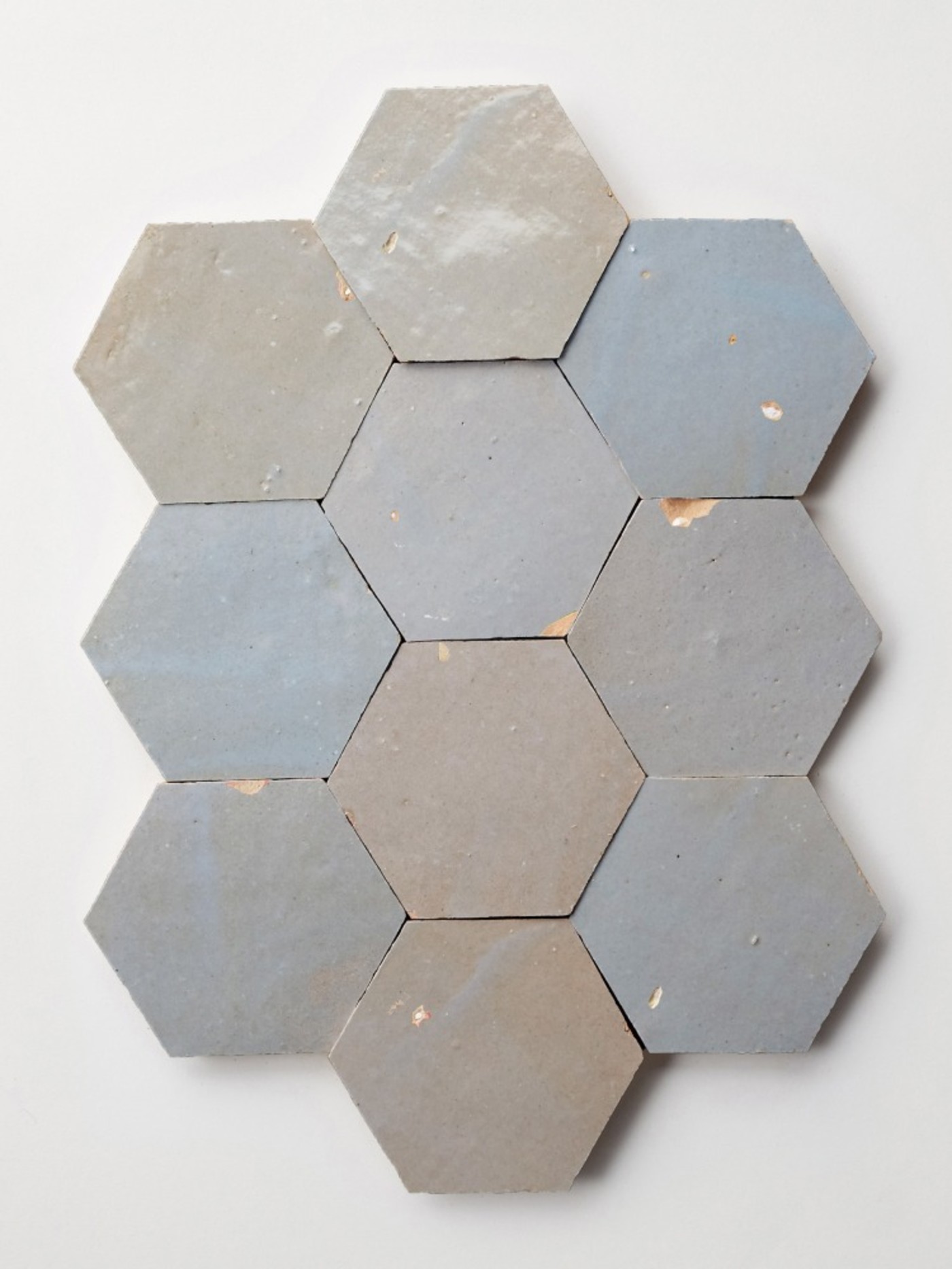 blue-grey hexagonal tiles on a white surface.