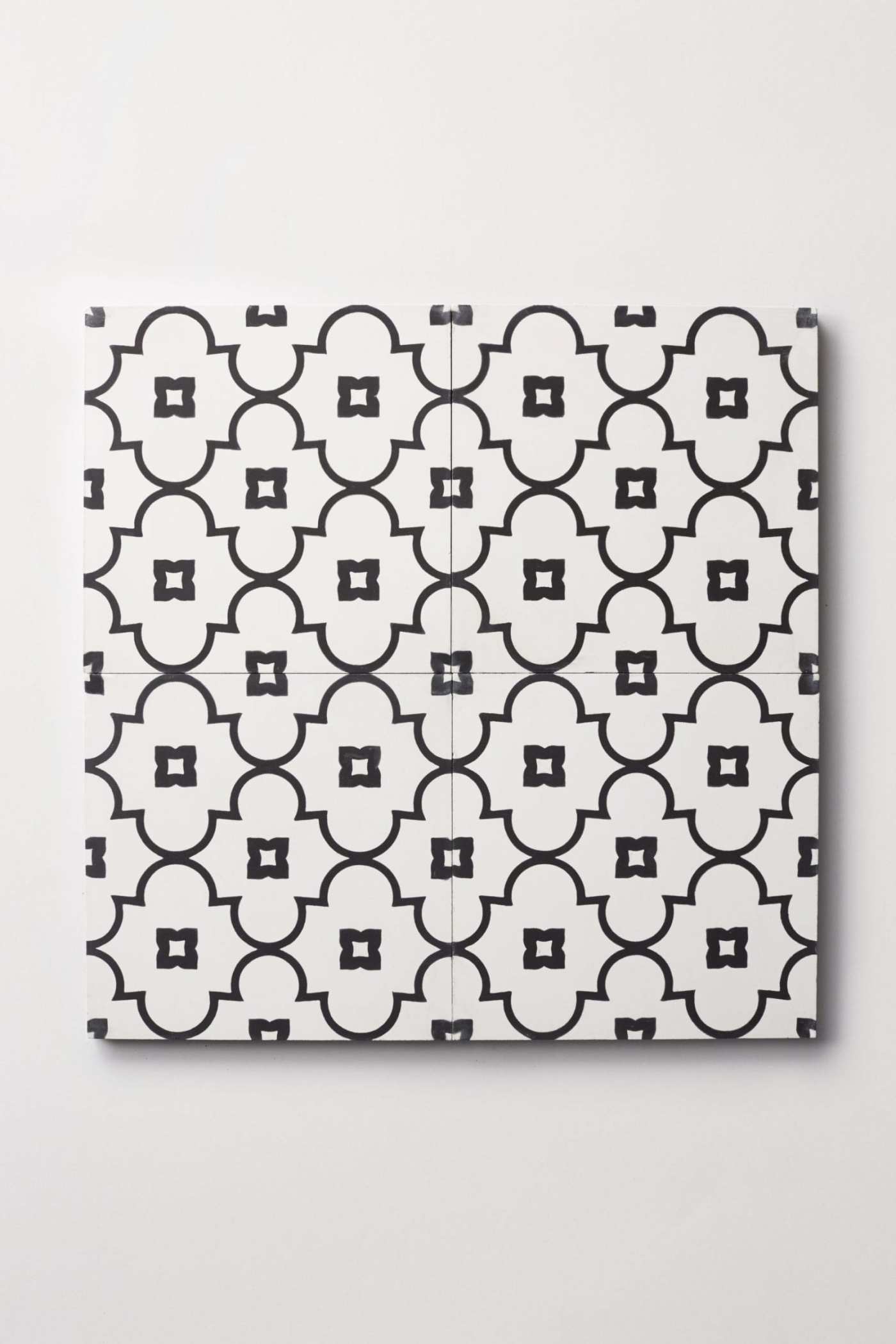 a black and white tile pattern on a white surface.