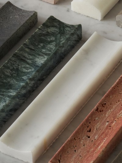 a row of different colored marble slabs on a table.