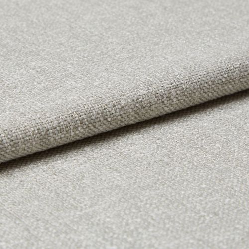 Beige woven fabric swatch, folded and layered, showing coarse basket-weave texture and subtle sheen; photographed in close-up with neutral lighting on a flat surface.