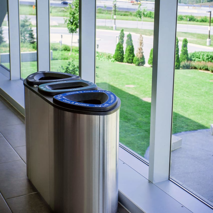 triple recycling organics and trash container with a stainless steel body at a university campus