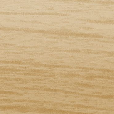 Light-colored wooden panel with subtle horizontal grain; smooth, matte surface occupying the frame; photographed close-up under even, warm studio lighting, no other objects or visible context.