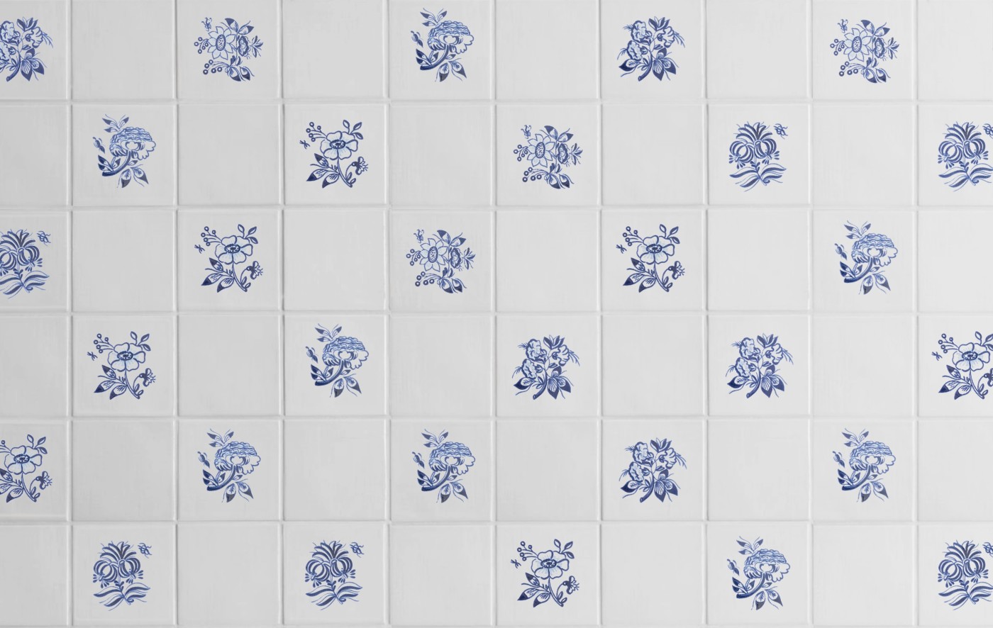 blue and white tiles with hand painted flowers on them.