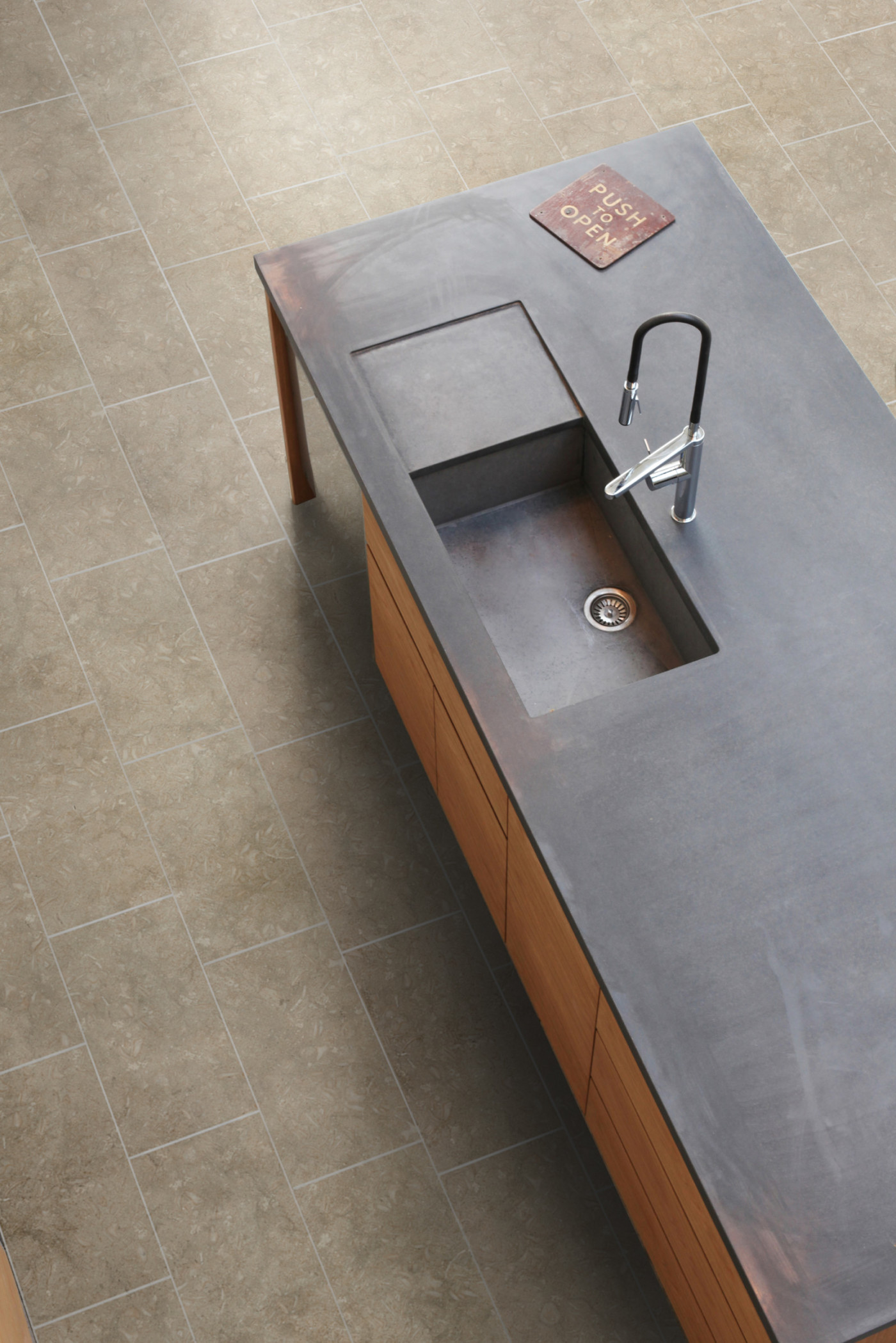 a kitchen with a sink and a counter top.