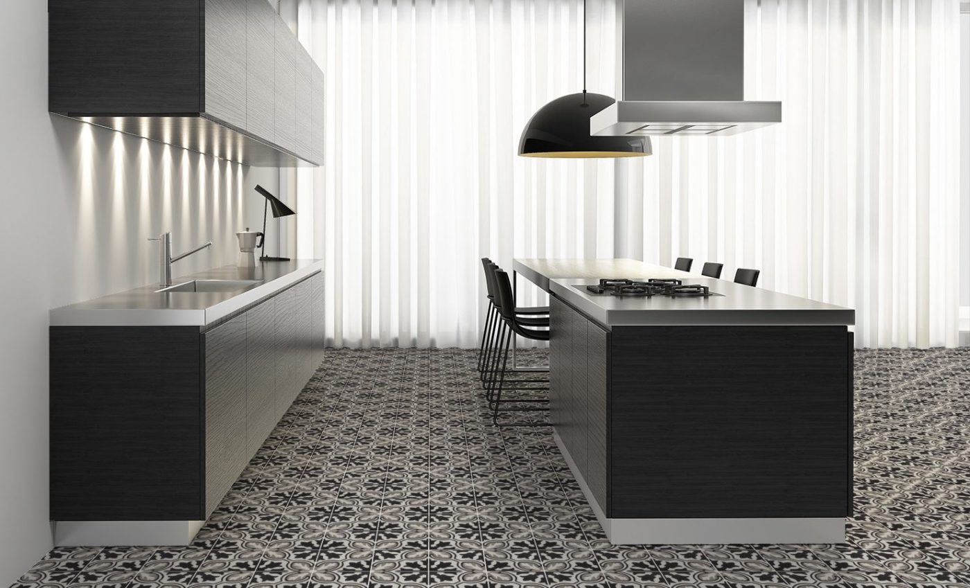 a kitchen with a black and grey tiled floor.