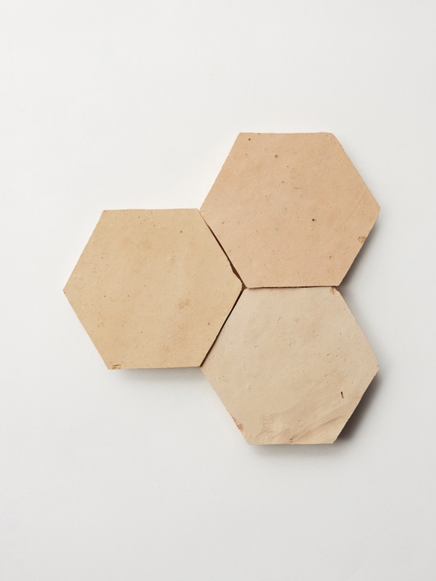 three hexagonal tiles on a white background.