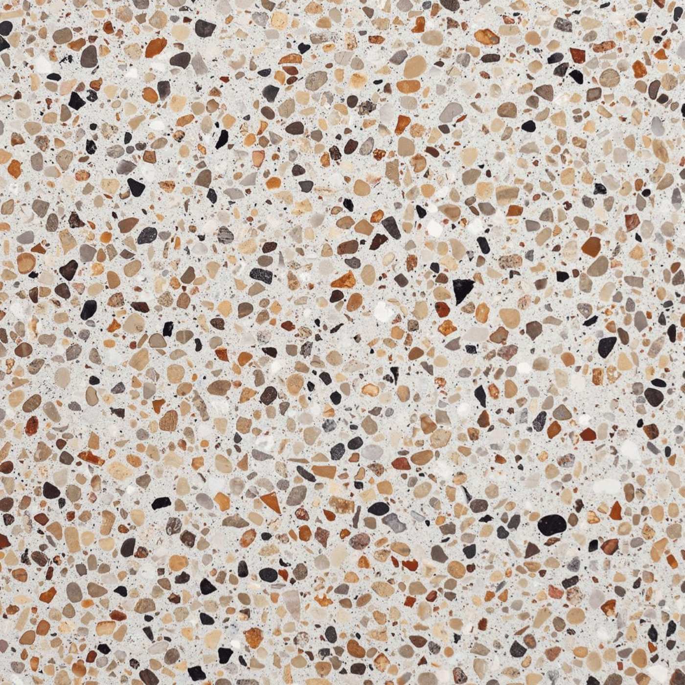 a close up image of a white tile with multicolored speckles.