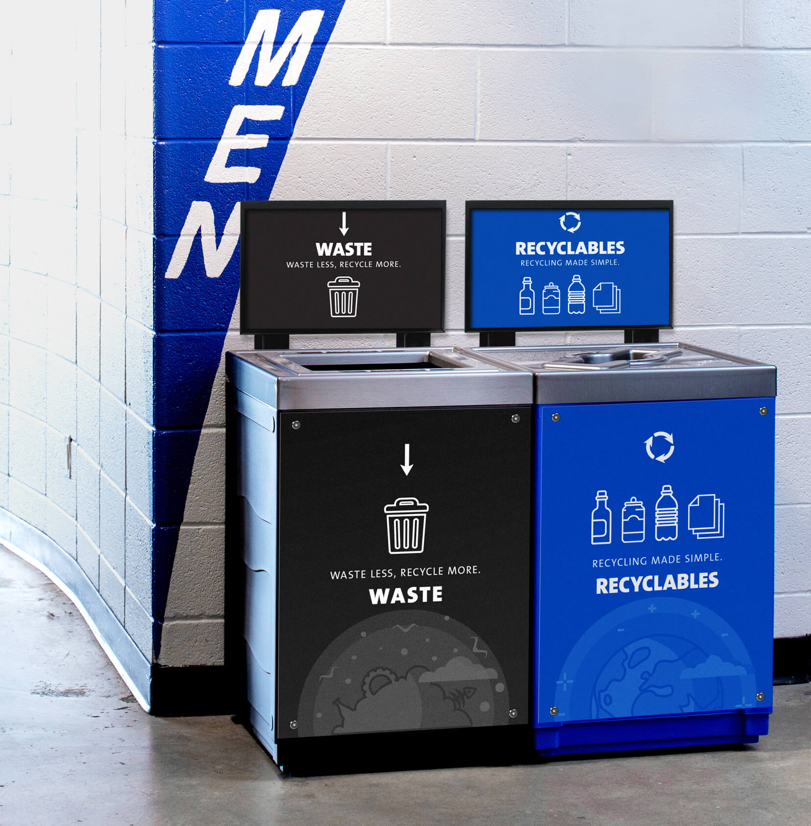 waste and recyclables bins with body signs and sign frames placed beside a washroom in a stadium