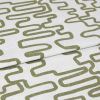 White linen-like fabric with olive-green meandering rectangular print, folded in layers, shown as a close-up textile sample on a neutral background under soft, even studio lighting.