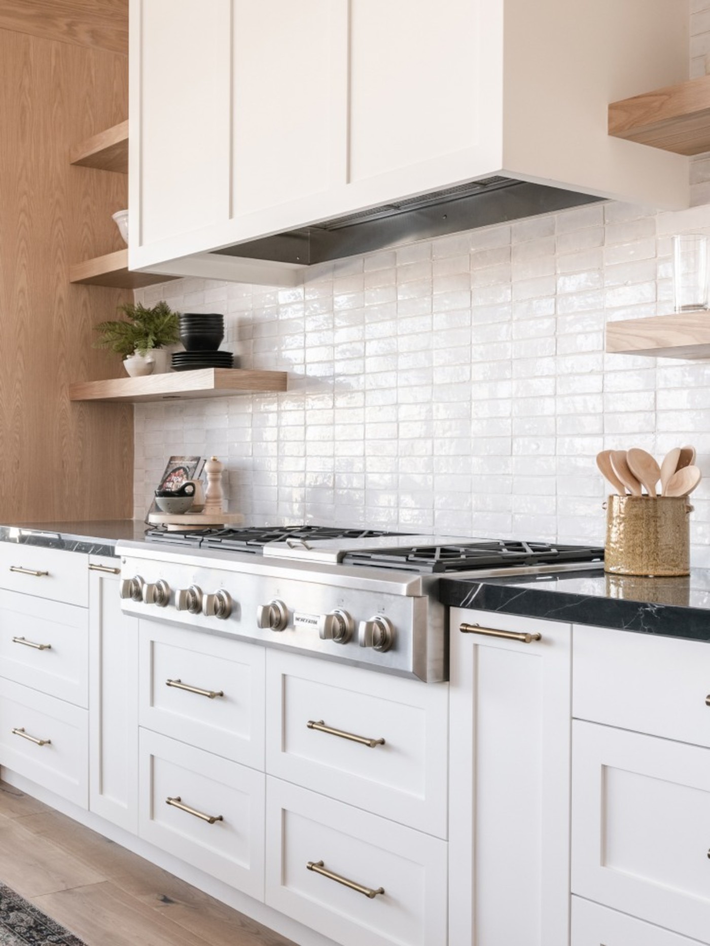 a kitchen with white tile backsplash.