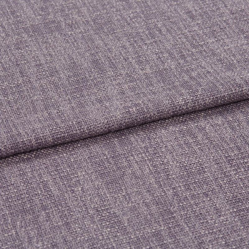 Textured mauve upholstery fabric folded once, showing woven looped weave and subtle sheen; even diffuse lighting on a flat surface, neutral background, no other objects.