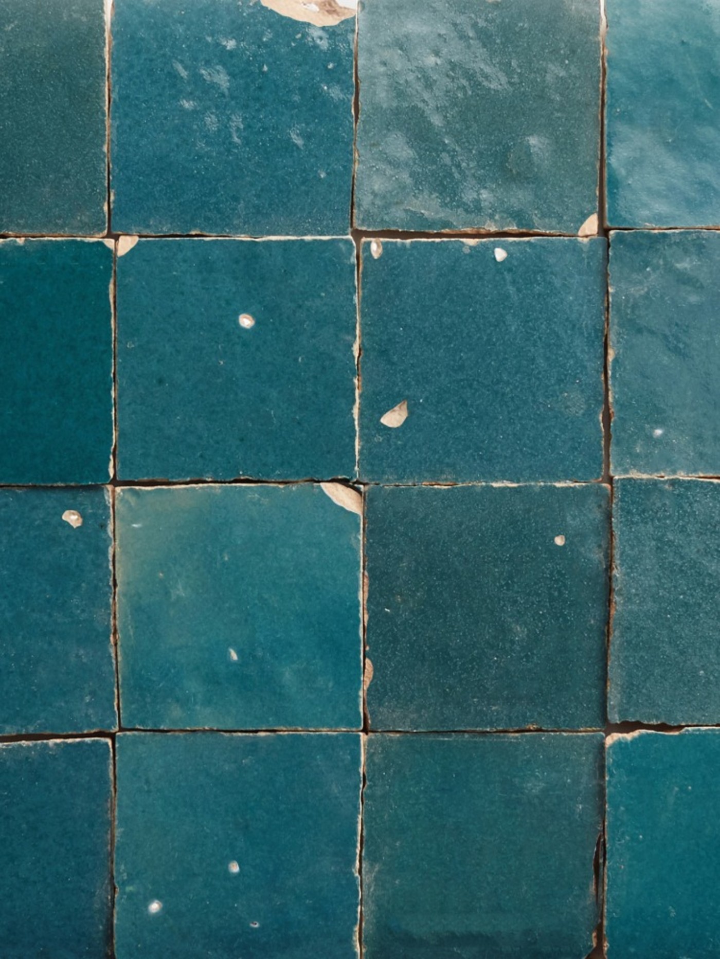 a close up of square blue tiles.