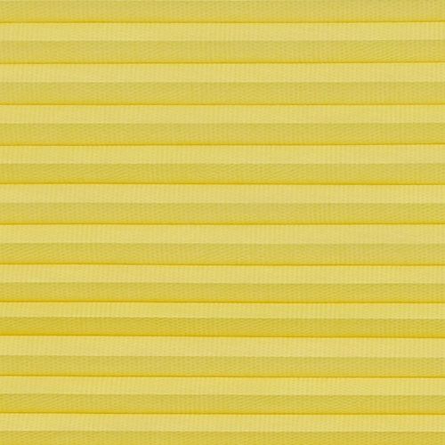 Yellow pleated cellular blind spanning the frame, horizontal accordion folds with textured fabric; fully lowered and closed, softly diffusing light in a neutral, evenly lit interior close-up with no visible view.
