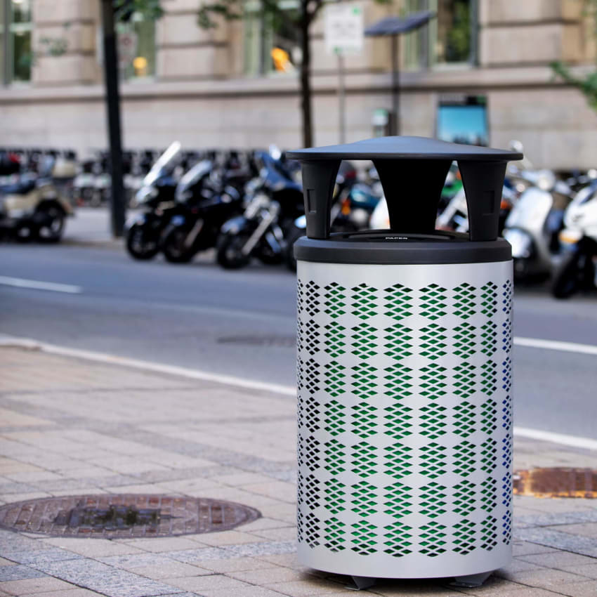 durable steel outdoor trash container with a black plastic canopy lid outdoors on a city sidewalk in front of a row of motorcycles