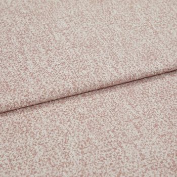 Pink-speckled upholstery fabric with a fine bouclÃ© texture, folded and layered along a horizontal crease; lying flat in a close-up view with soft, even lighting.