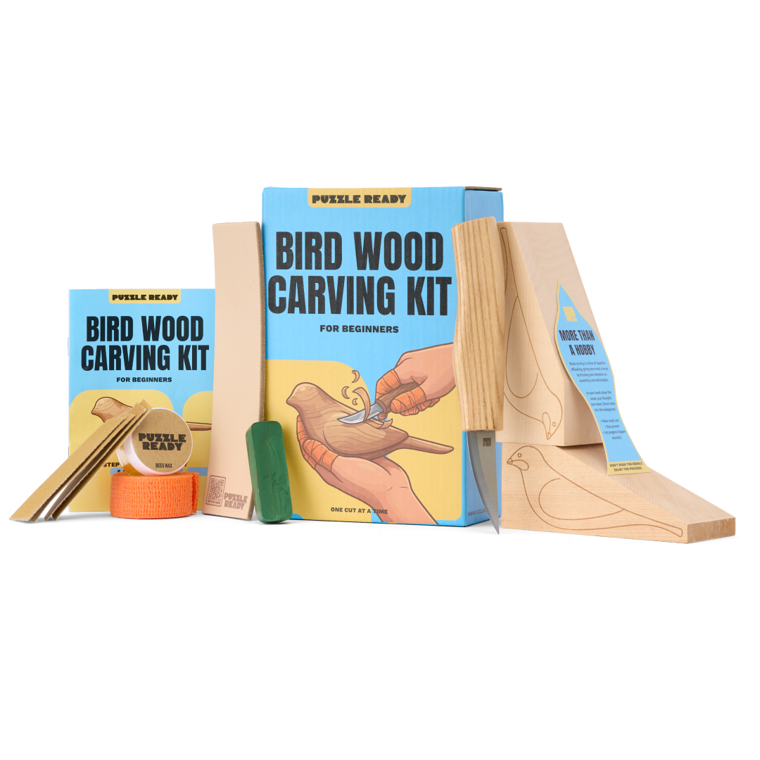 Puzzle Ready Bird Wood Carving Kit box with carving knife, cedar bird blocks, strop and sandpaper