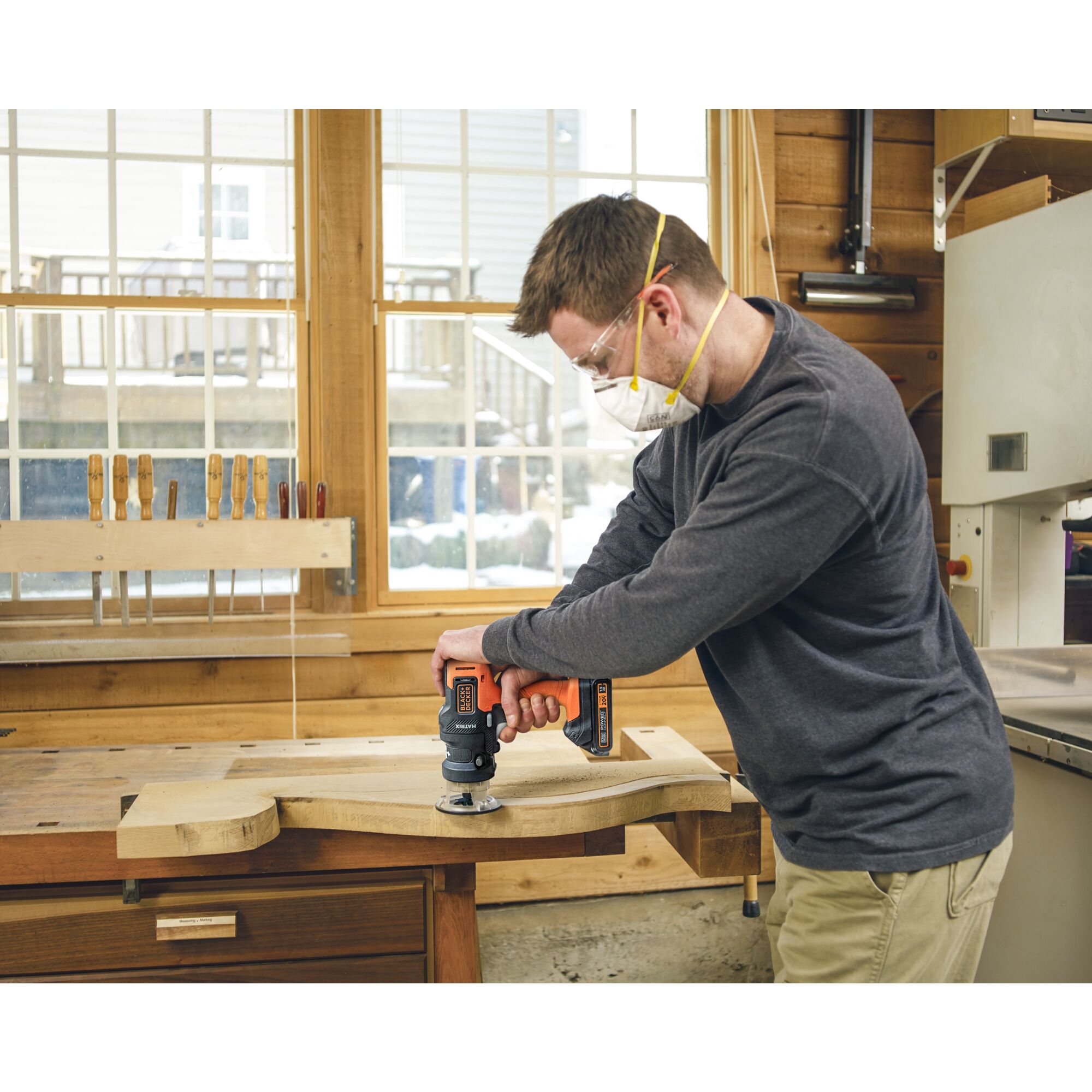 Person using maxtrix router attachment on a piece of wood