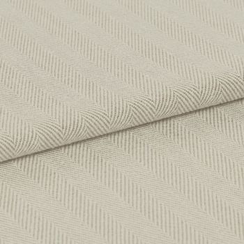 Cream herringbone-woven fabric folded diagonally, showing raised ribbed chevron pattern; laid flat under soft, even lighting for a close-up textile detail.
