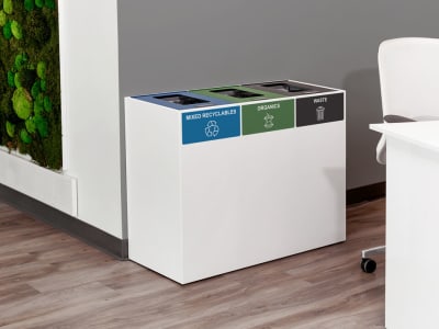 white powder coated steel mixed recyclables and waste container in an upscale office building