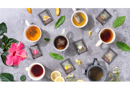 Cups of the Assortment of steep by Bigelow teas shwing ingredients