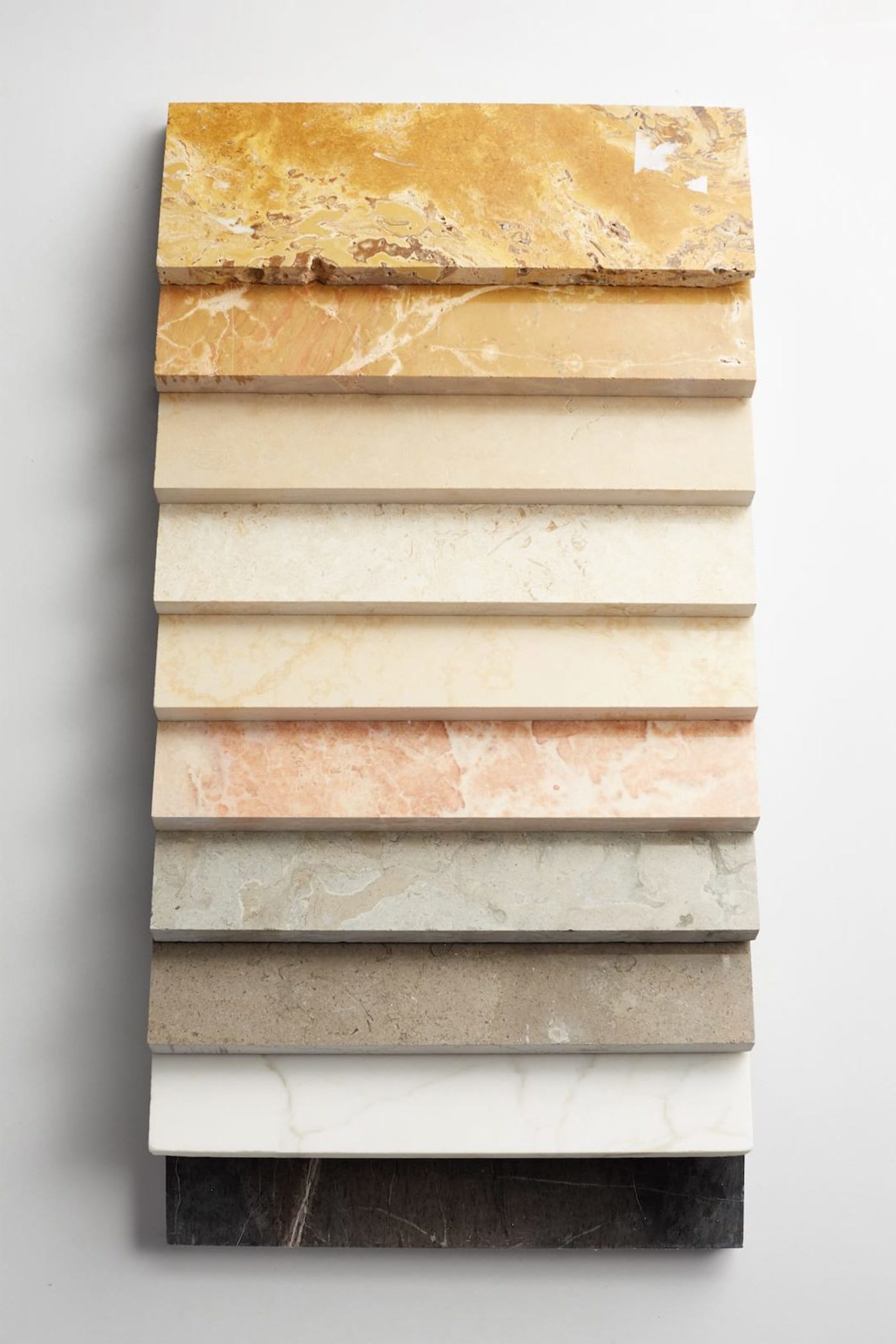 a row of marble slabs on a white background.