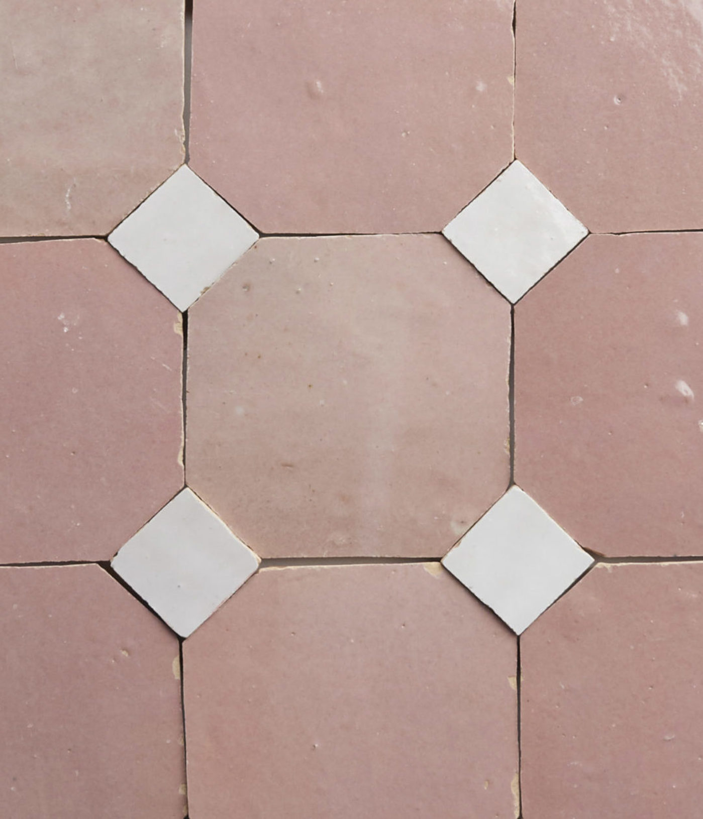 pink and white tiles arranged in a pattern.