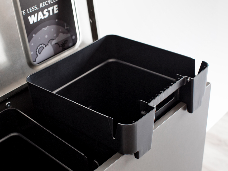 closeup of waste bin liner hooking over the edge making servicing easier for custodial staff