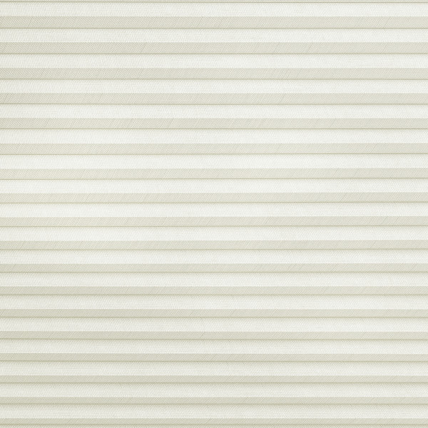 Cream-colored cellular (honeycomb) blind with narrow horizontal pleats, fully lowered and closed, gently filtering diffuse daylight while covering the entire window area in a neutral indoor setting.