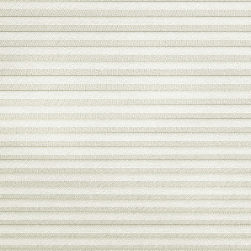 Cream-colored cellular (honeycomb) blind with narrow horizontal pleats, fully lowered and closed, gently filtering diffuse daylight while covering the entire window area in a neutral indoor setting.