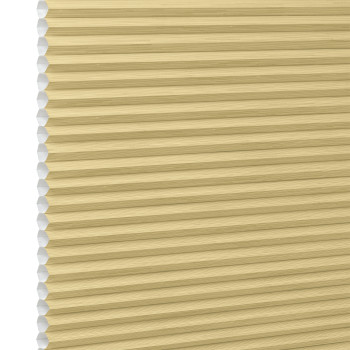 Honeycomb cellular blind, beige with visible hexagonal cells at left edge and narrow horizontal pleats â€” fully lowered and closed, filtering soft light in a close-up, neutral setting.