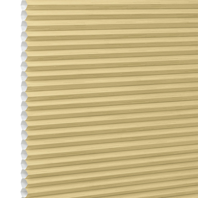 Honeycomb cellular blind, beige with visible hexagonal cells at left edge and narrow horizontal pleats â€” fully lowered and closed, filtering soft light in a close-up, neutral setting.