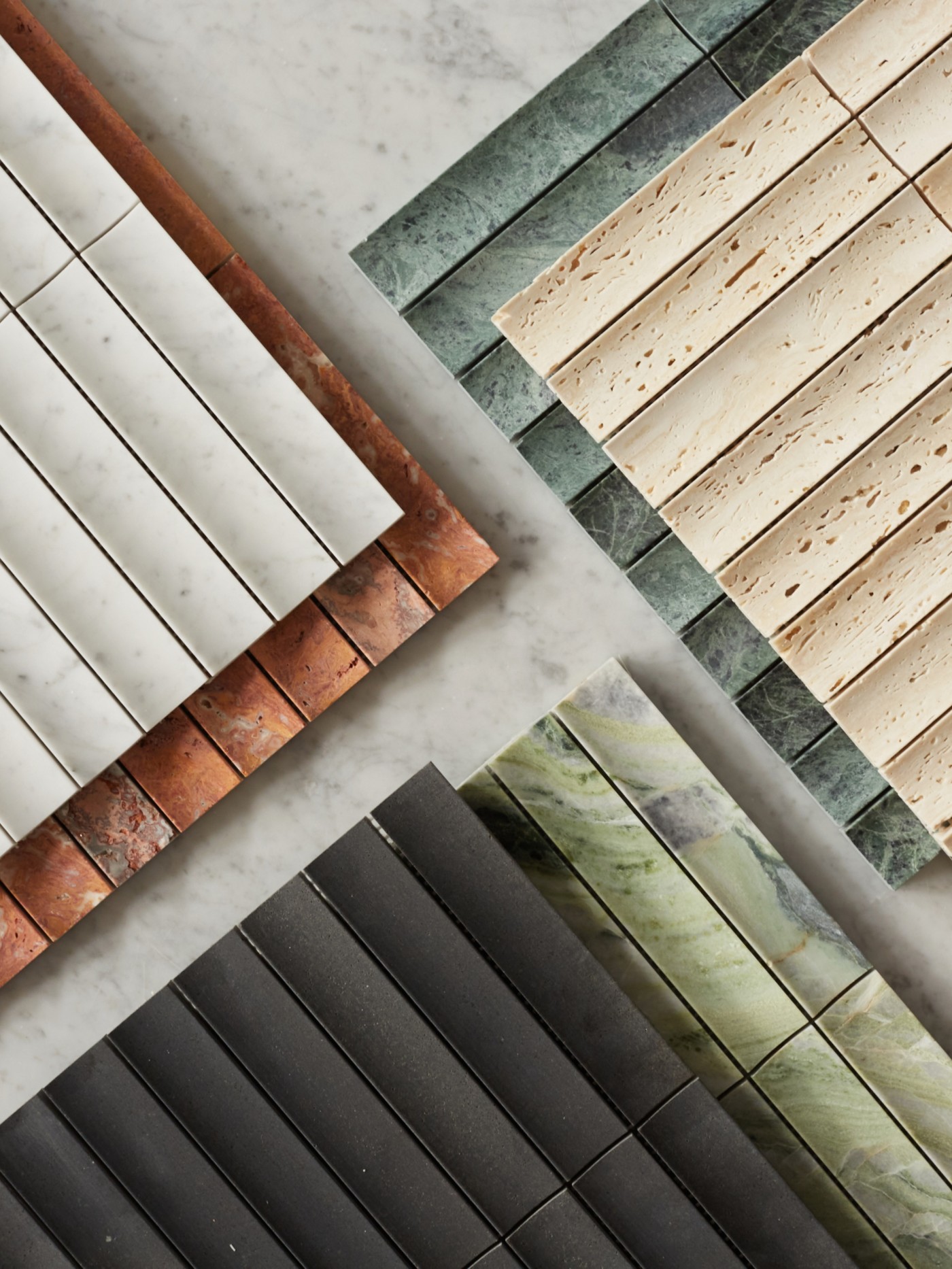 rows of different-colored tiles arranged on a marble surface.