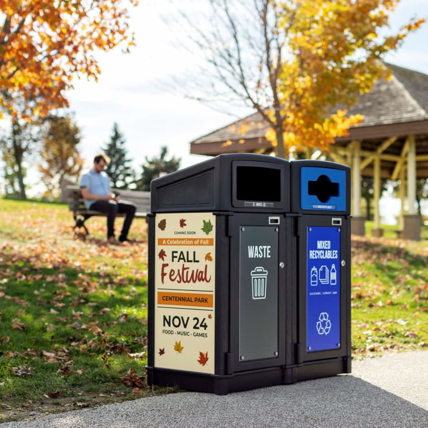 double stream outdoor durable trash and recycling container with sloped canopy lids and large bold body signs including ad space for generating revenue