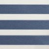 Zebra roller blind with wide navy-blue textured and white sheer horizontal bands, alternating to filter light, mounted indoors under soft ambient lighting with no visible outside view.