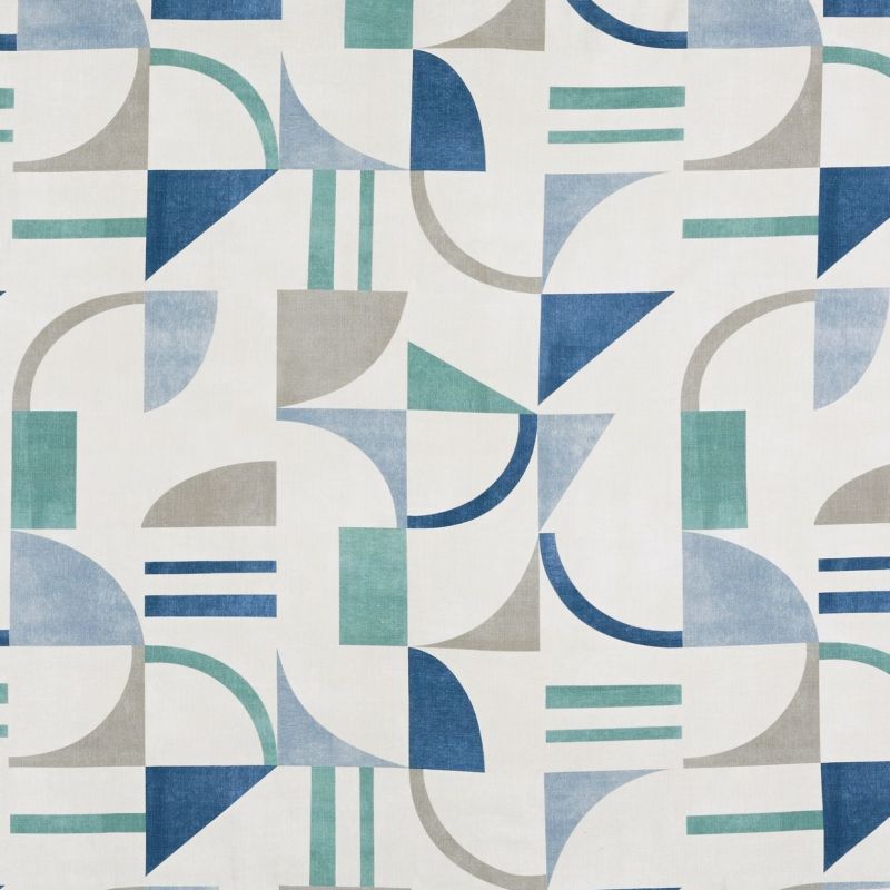 Geometric patterned fabric featuring blue, teal and gray semicircles, triangles and bars — repeating in a tiled grid, creating alternating arcs and angles against an off‑white background with flat, even lighting.