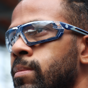Person wearing blue tinted safety glasses.