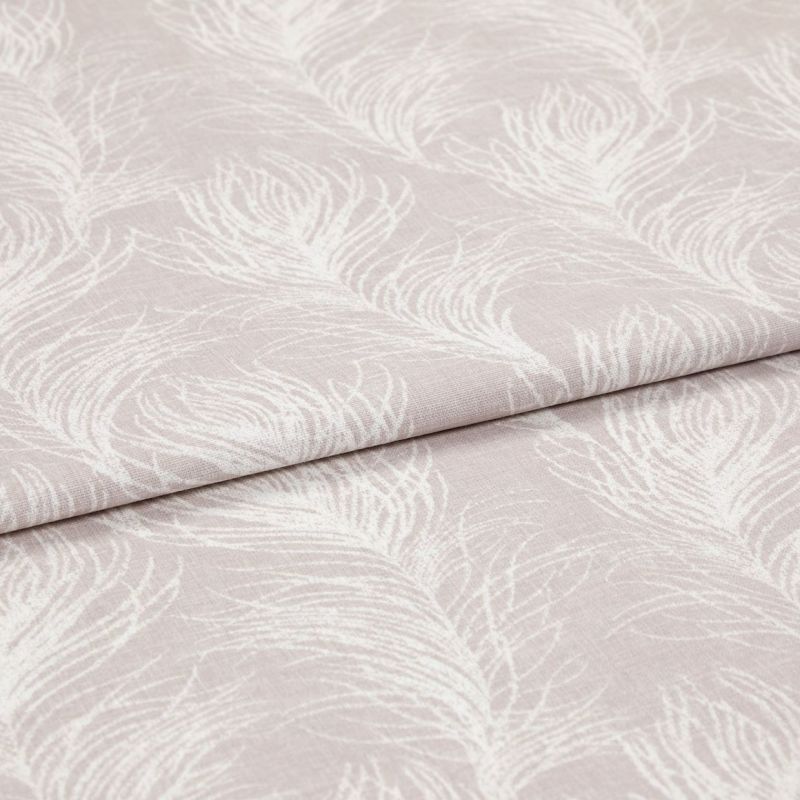 Folded pale blush fabric with white feather print (curtain/ upholstery textile), displayed flat; folds emphasize texture and repeating feather motif, shown under soft, even studio lighting.