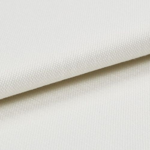 Cream-coloured textured canvas fabric, folded with one layer overlapping another, showing tight plain weave; photographed under soft studio lighting on a neutral background, close-up detail of surface.