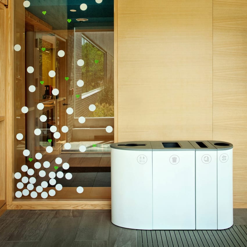 all white powder coated steel trash and recycling bins in the lobby of a municipal library