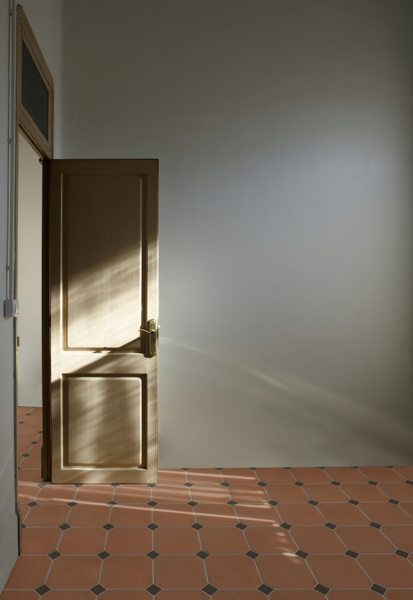 an open door in an empty room.