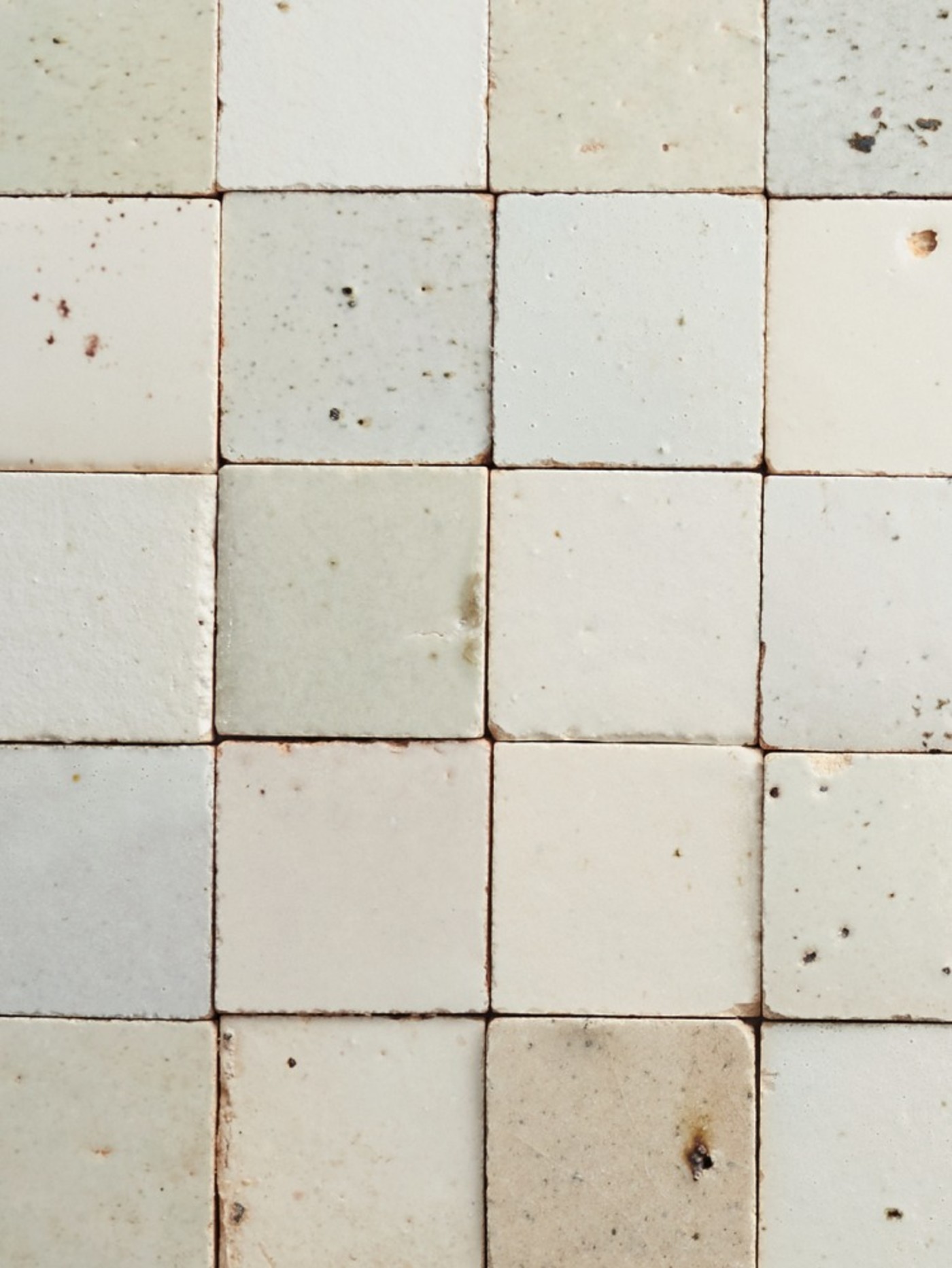 a close up image of a white tile surface.